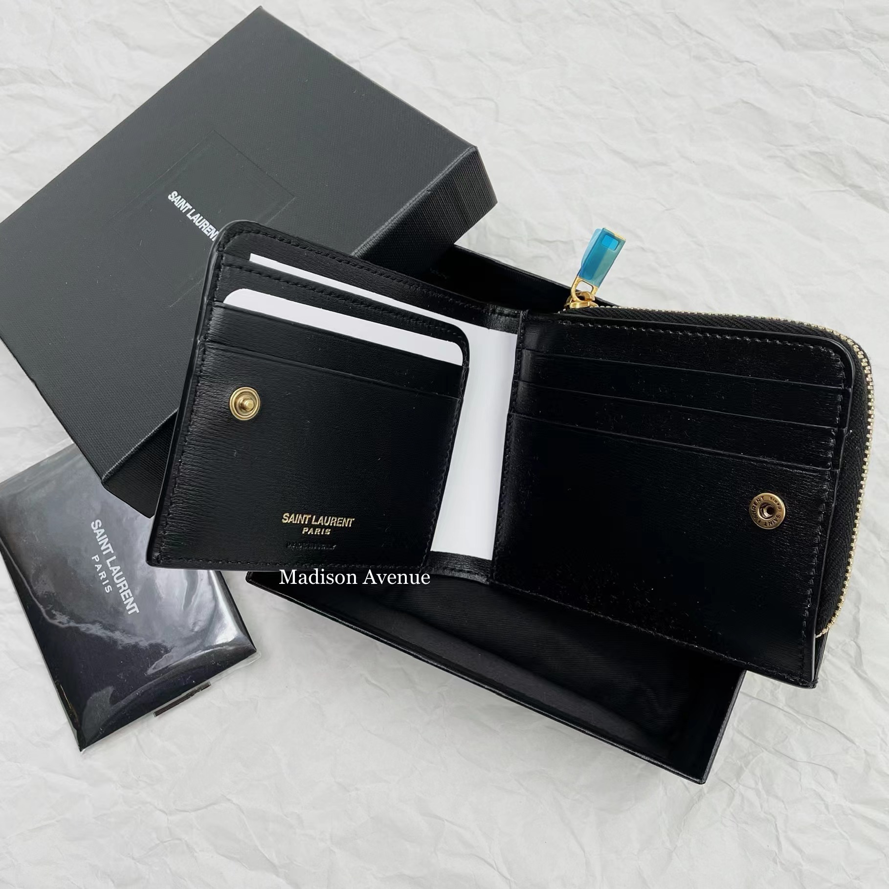 Saint Laurent TINY MONOGRAM EAST/WEST ZIP-AROUND WALLET IN SMOOTH LEATHER (64458702G0W 1000) Saint Laurent TINY MONOGRAM EAST/WEST ZIP-AROUND WALLET IN SMOOTH LEATHER (64458702G0W 1000)