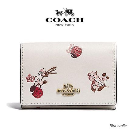 花柄 Coach x 折りたたみ財布(レディース) - 海外通販のBUYMA