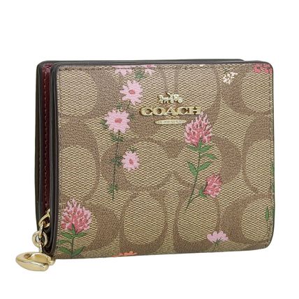 花柄 Coach x 折りたたみ財布(レディース) - 海外通販のBUYMA