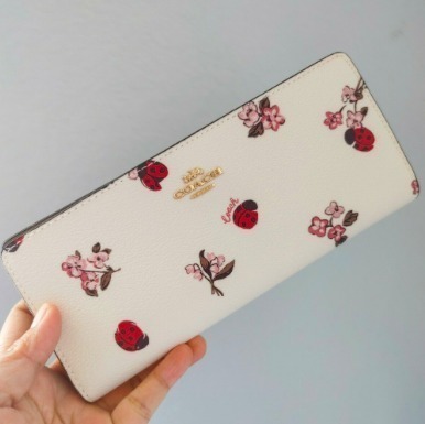 セール☆Coachフローラル＆レディーバグ柄スリム二つ折り長財布