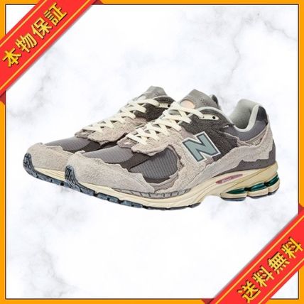 Shop New Balance 2002 Unisex Street Style Logo Sneakers (M2002RDA