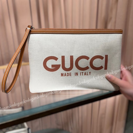 GUCCI Clutches Clutch with Gucci print