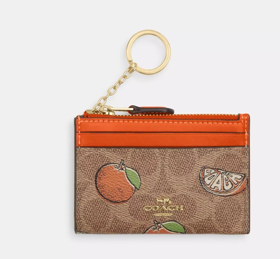 COACH オレンジプリントのミニスキニーIDケース