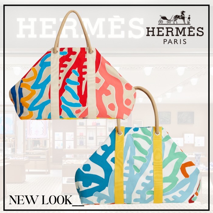 《青い空に映えるバッグ》HERMES ビーチバッグ