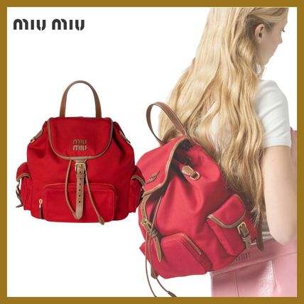 日常にエレガンス*miumiu*キャンバスxレザー バックパック mini ブルー／ブラウン キャンバスxレザー バックパック | Miu Miu