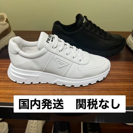 PRADA 直営店より レザー スニーカー メタルロゴ付 org.jpg