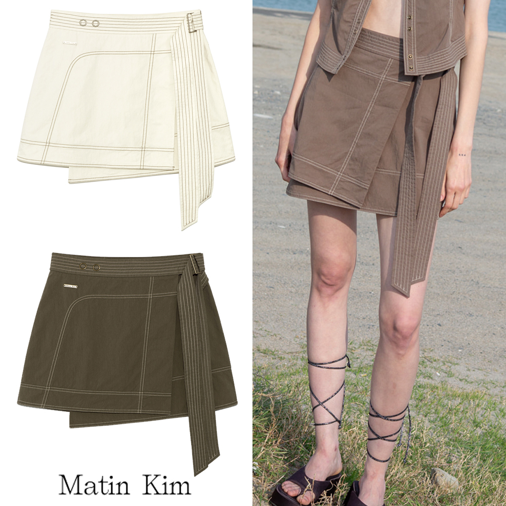 無料配送 ◆ MATIN KIM ◆ STITCH POINT BELTED WRAP SKIRT