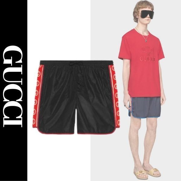 グッチ ロゴ ストライプ付き ナイロン スイムショートパンツ (GUCCI