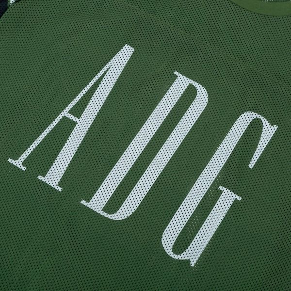 【Denim Tears】ADG Inc. メッシュ バーシティ Tシャツ グリーン DenimTears】ADG Inc. メッシュ バーシティ ティー グリーン